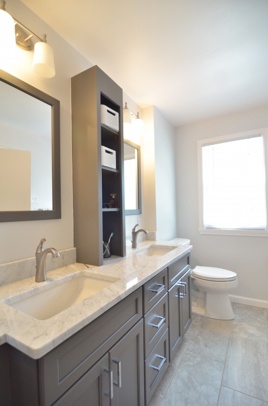 Bathroom shelves between shop mirrors