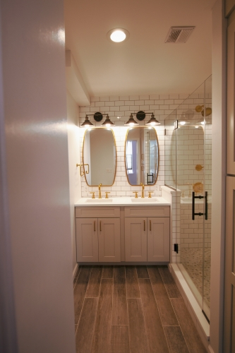 Bathroom Wood Look Floor and Gold Fixtures