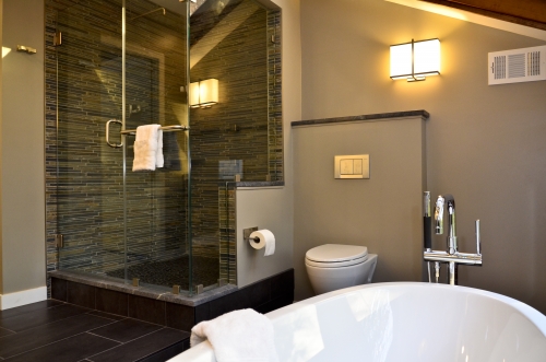 Bathroom Frameless Glass Shower mastser earthy nature freestanding tub chrome slate pebble floor