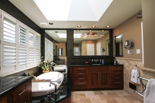 Bathroom Modern Master Suite wood vanity wall mounted faucet jacuzzi tub skylight inset cabinetry