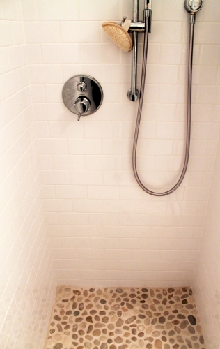 Bathroom Pebble Shower Floor white subway tile shower wall tile chrome handheld shower