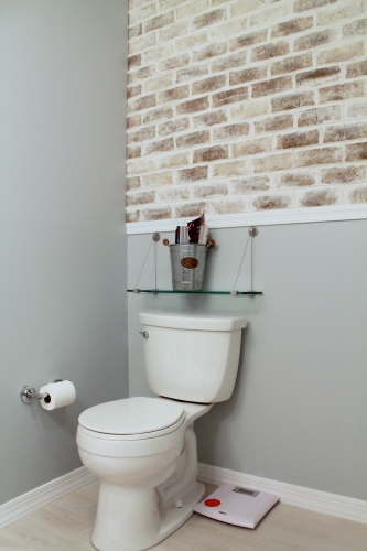 Bathroom Wood Plank Floor suspended glass shelf brickwork