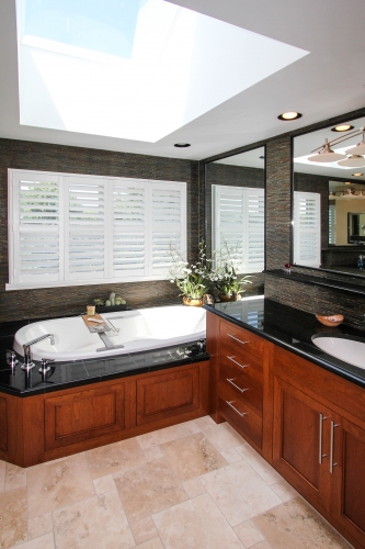 Master Bathroom Jacuzzi Tub skylight black granite wood double vanity