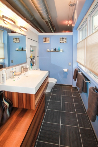 Master Bathroom Master Bath Suite exposed ductwork floating vanities wallhung dark floors light blue