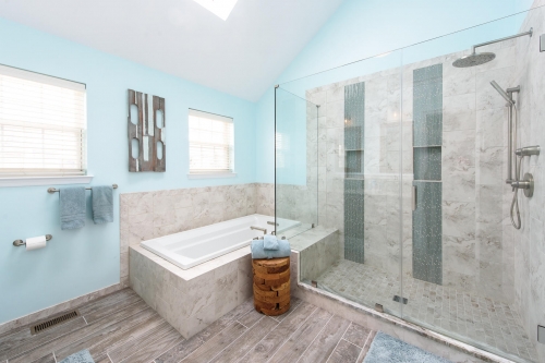 Transitional Master Bath Teal Wall Paint Wood Look Tile Double Skylight Frameless Glass Enclosure Jacuzzi Tub