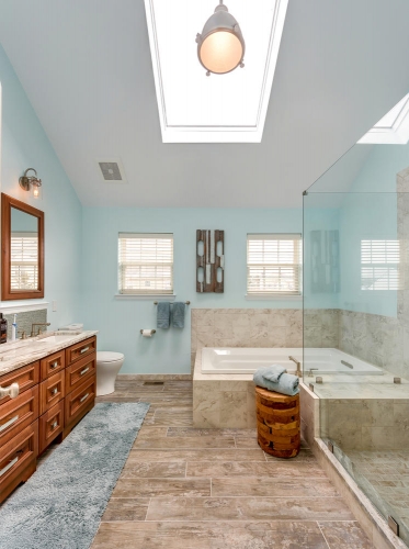 Transitional Master Bath Teal Wall Paint Wood Look Tile Double Vanity Skylight Frameless Glass Enclosure