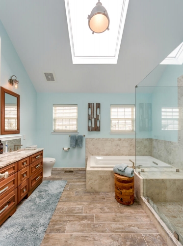 Transitional Master Bath Teal Wall Paint Wood Look Tile Double Vanity Skylight Frameless Glass Enclosure