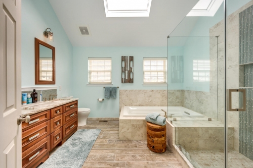 Transitional Master Bath Teal Wall Paint Wood Look Tile Double Vanity Skylight Frameless Glass Enclosure Jacuzzi Tub