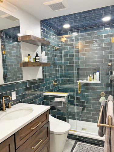  green subway tile brown vanity white countertop gold fixtures glass enclosure gold fixtures dRemodeling