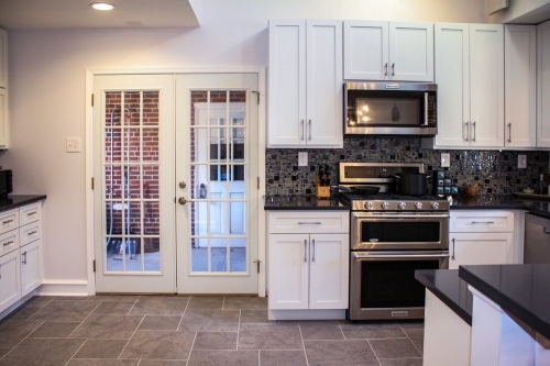 casual white shaker kitchen french doors