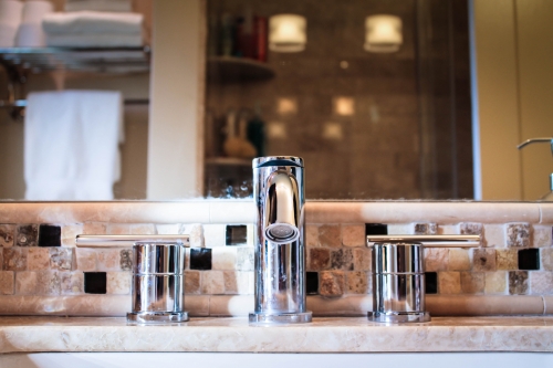 compact bathroom chrome finishes stone natural