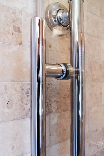 compact bathroom walkin shower chrome finishes stone natural storage light floor transition