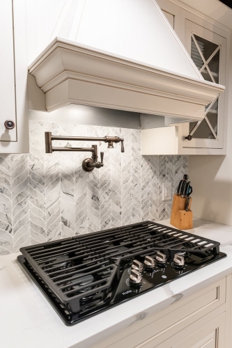 historic kitchen renovation pot filler faucet in backsplash