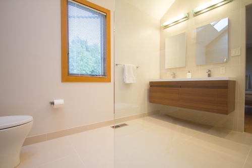 master bath remodel large format tile curbless shower beige modern glass panel(1)