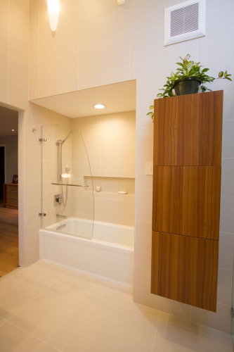 master bath remodel large format tile glass panel recessed niche linen closet