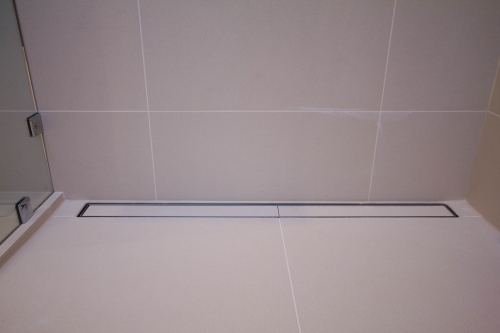 master bath remodel linear drain curbless shower beige modern(1)