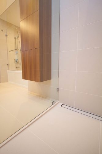 master bath remodel linear drain curbless shower beige modern