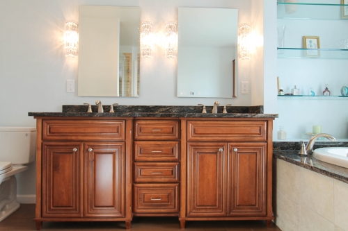 master bathroom remodel natural stone jacuzzi tub glass frameless shower enclosure corner shelves granite hardwood