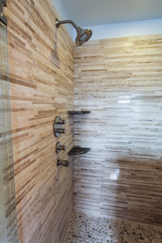 master bathroom remodel natural stone jacuzzi tub glass frameless shower enclosure corner shelves granite hardwood dark blue var