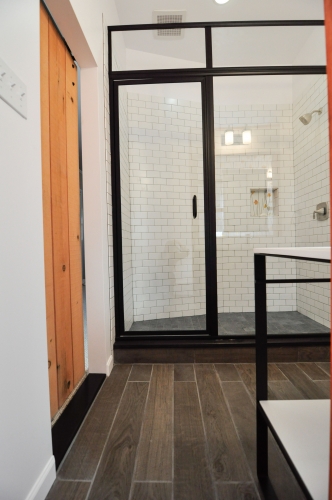 modern industrial bath factory shower door sliding barn wood look porcelain tile subway black mosaic shower floor