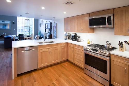 natural wood transitional kitchen gas range