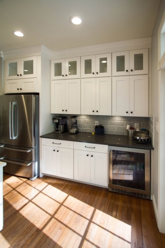 white shaker kitchen stacked glass cabinets