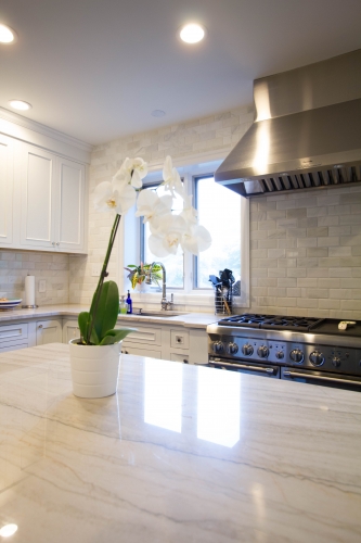 white traditional kitchen remodel stainless range hood