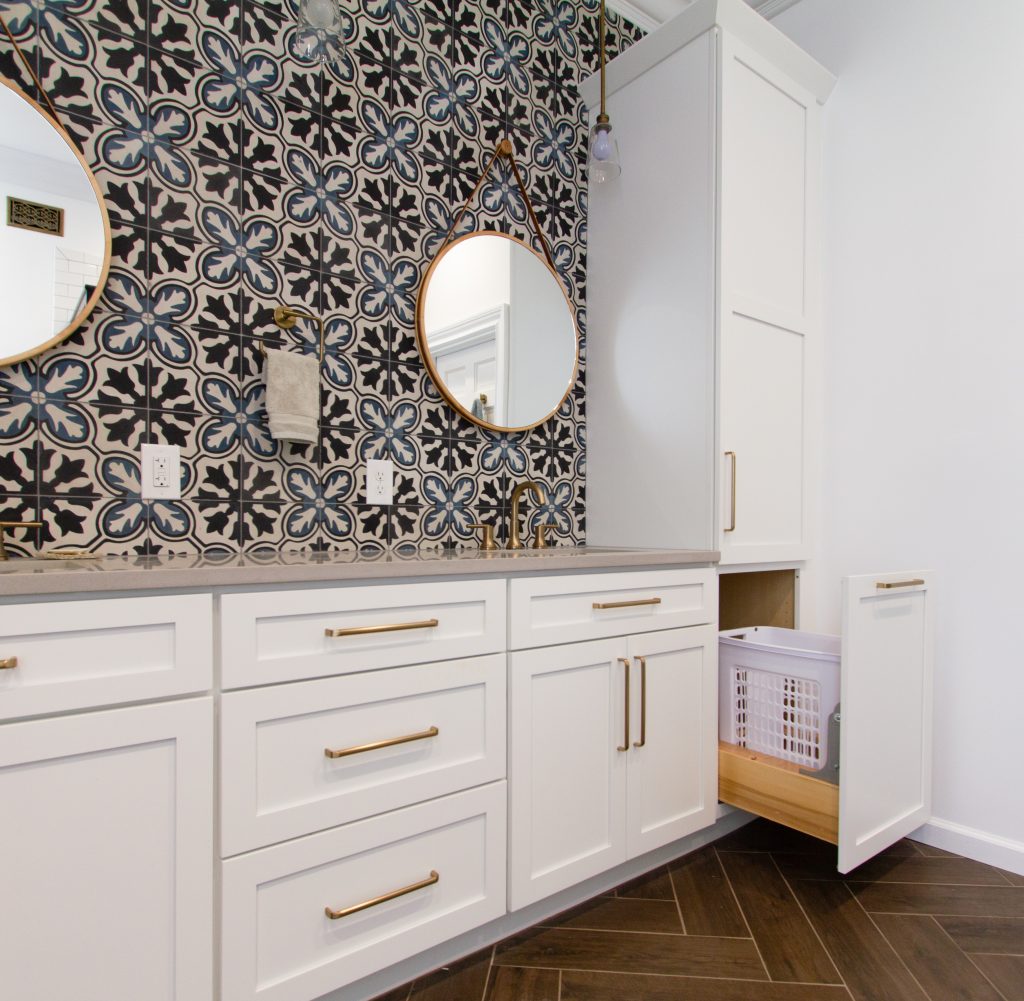 Accent-Wall-Bronze-Fixtures-White-Cabinetry-Vanity