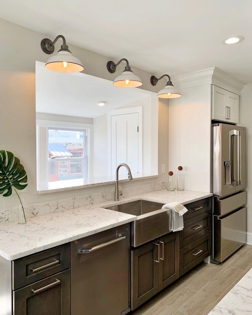 https://www.dremodeling.com/uploads/2019/06/Quartz-Countertops-Light-Fixtures-Stainless-Steel-Kitchen-819x1024.jpg